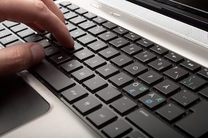 person using a computer keyboard