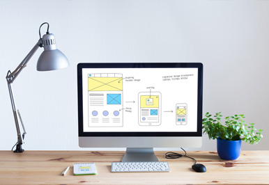 Computer displaying responsive design mockups