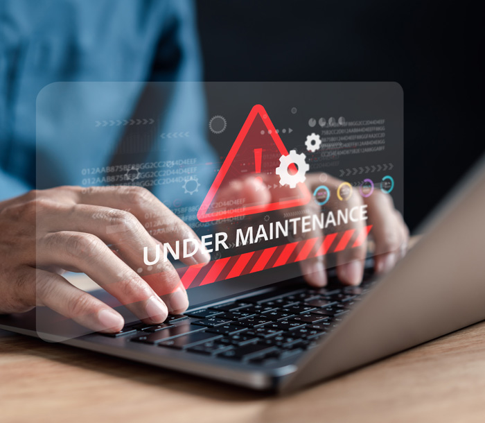 Laptop displaying maintenance warning message