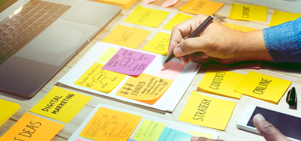 Colorful sticky notes and laptop.