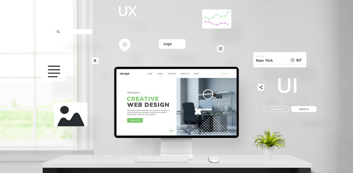 Desktop computer displaying web design.