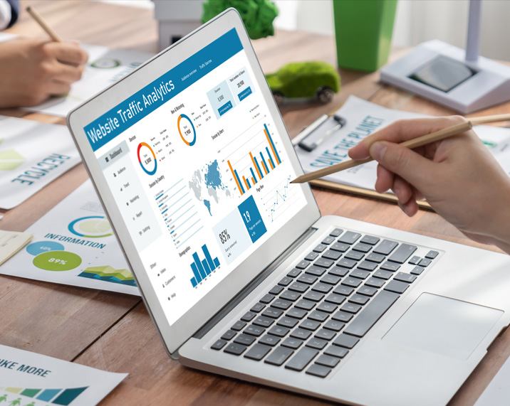 Laptop displaying website traffic analytics.