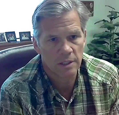 Middle-aged man in plaid shirt