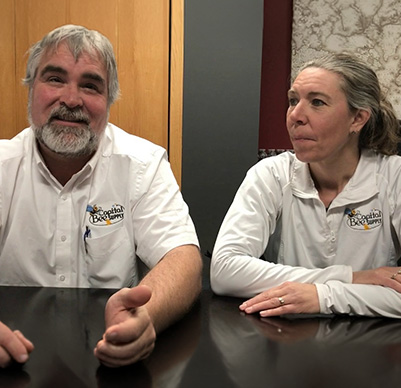 Two people in white shirts