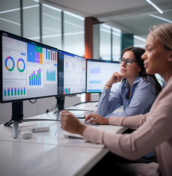 Two women at monitors